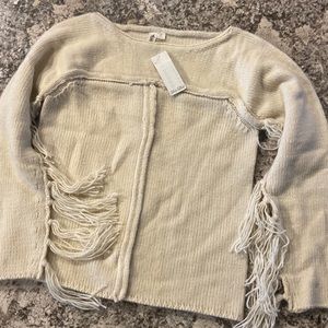 Pretty and thick cream sweater with fringe along the sleeves Women’s small
